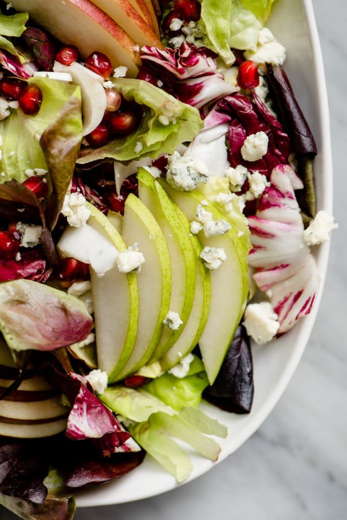 This winter chopped salad with endive, pears, and pomegranate is fast, easy, and...