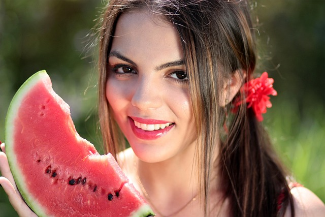 An image capturing a serene scene of a woman sitting under a tree, enjoying a juicy watermelon slice during her period